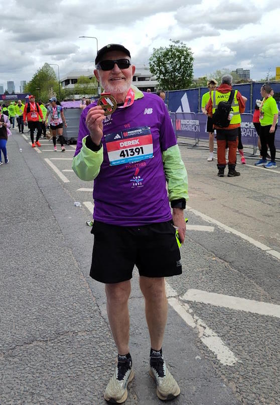 click to see larger image Derek at the end of the 2024 Manchester Marathon, which he ran for RADAR